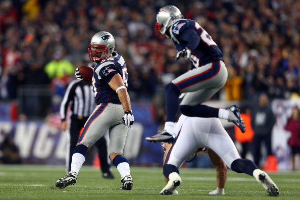 FOXBORO, MA - JANUARY 13: Rob Ninkovich #50 of the New England Patriots runs with the ball after an interception against the Houston Texans during the 2013 AFC Divisional Playoffs game at Gillette Stadium on January 13, 2013 in Foxboro, Massachusetts. (Photo by Elsa/Getty Images)