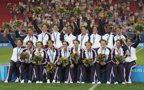 ATHENS - AUGUST 26:  Team USA receives the Gold medal in women's football after beating Brazil 2-1 in extra time on August 26, 2004 during the Athens 2004 Summer Olympic Games at Karaiskaki Stadium in Athens, Greece.